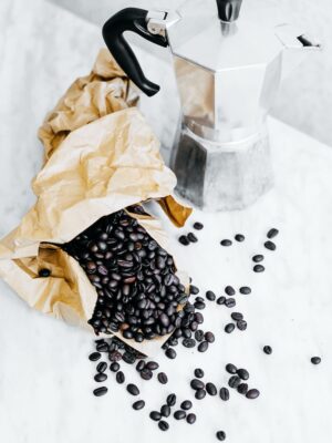 black coffee beans and gray mocha pot